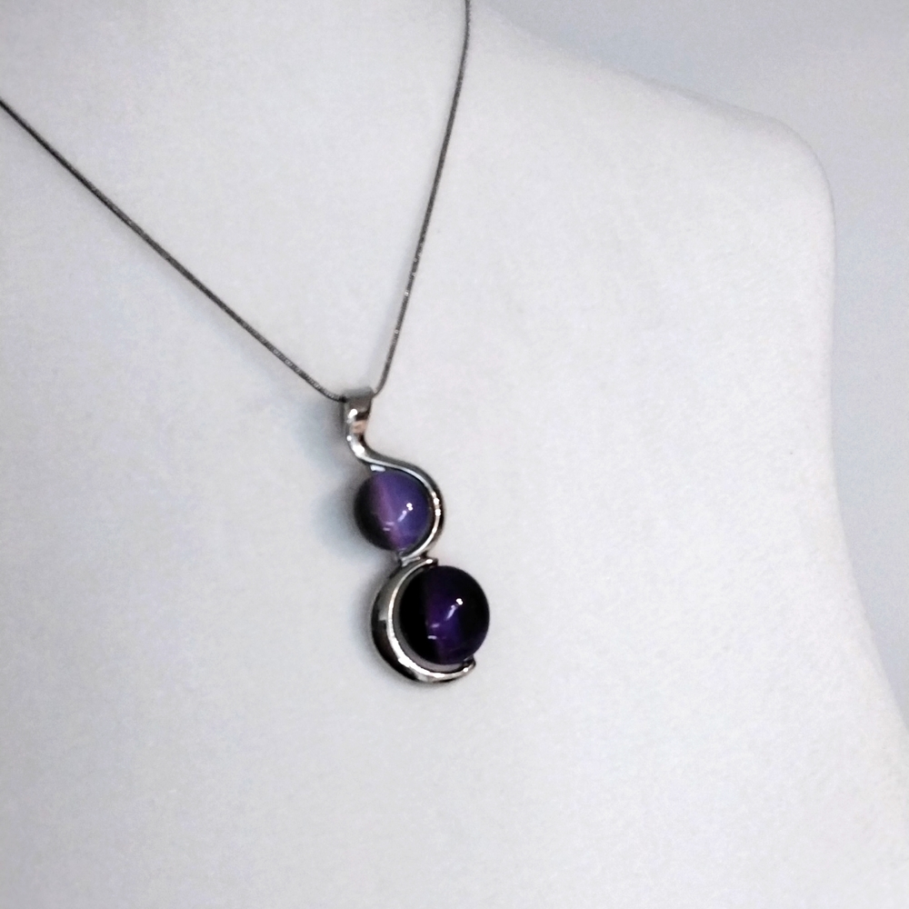 Silver necklace with purple stone pendant